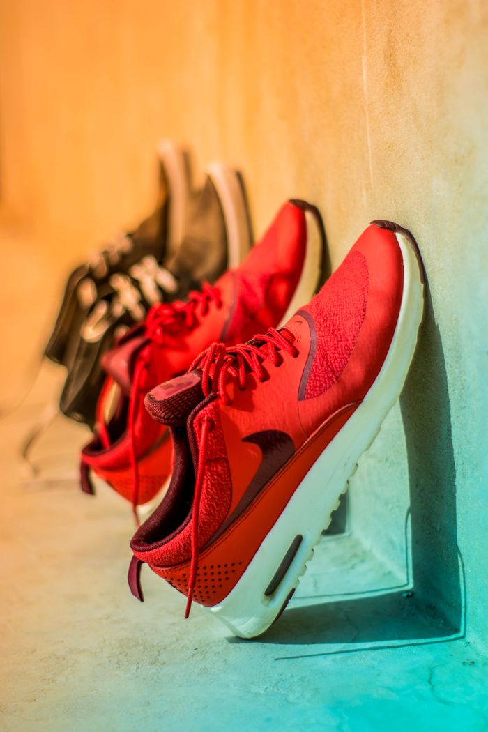 services-02 Vibrant red sneakers on display, showcasing modern footwear style.